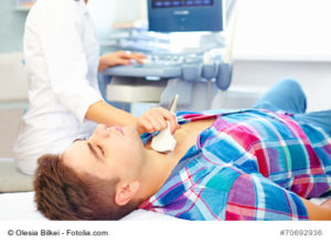 man undergoing the medical ultrasound examination